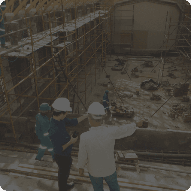 Construction workers planning on a building site